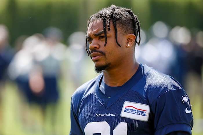 Seattle Seahawks wide receiver Bo Melton (81) returns to the locker room following an OTA workout at the Virginia Mason Athletic Center.